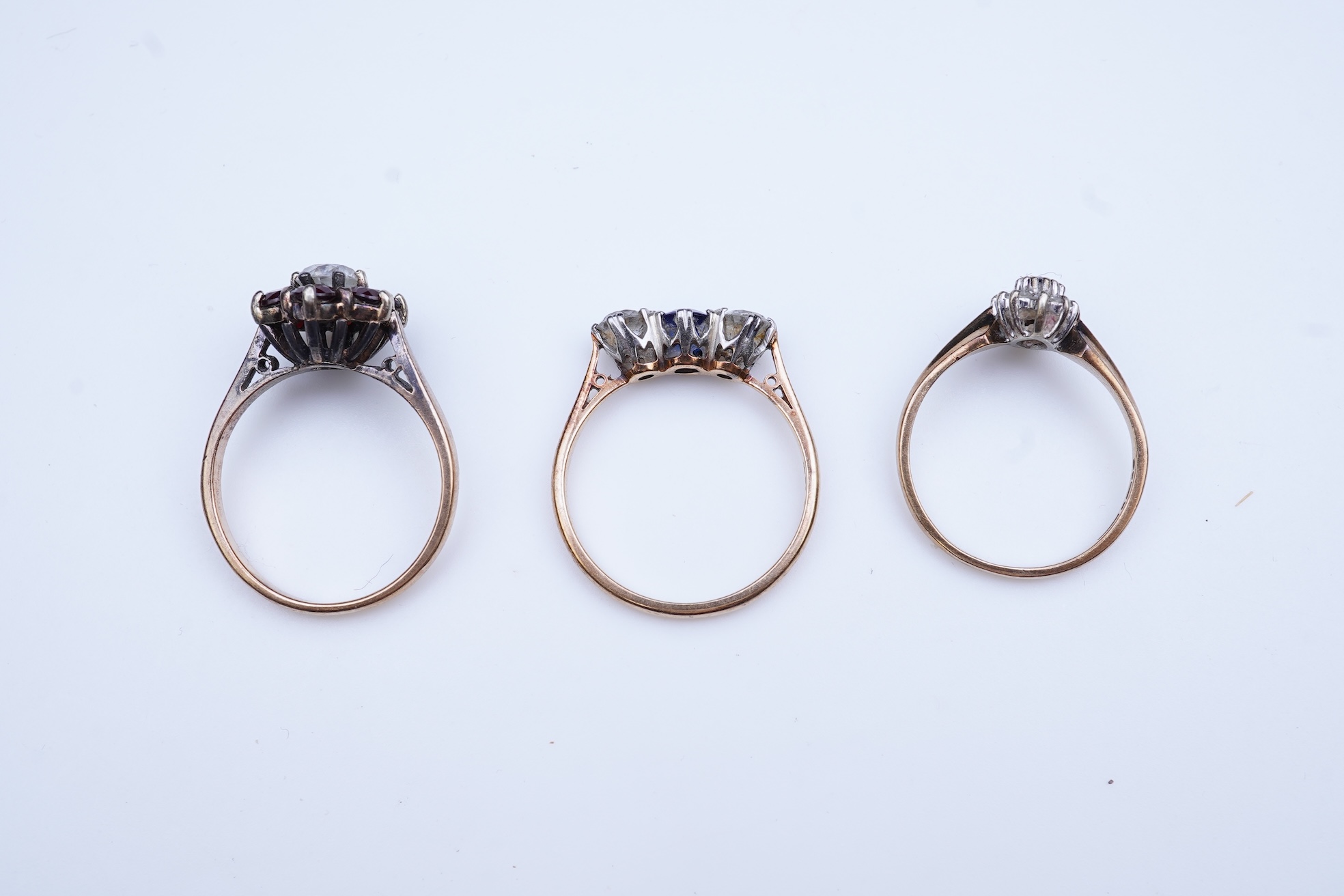A group of three rings and a tie pin
